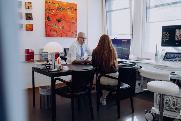 Dr Singer counselling a patient