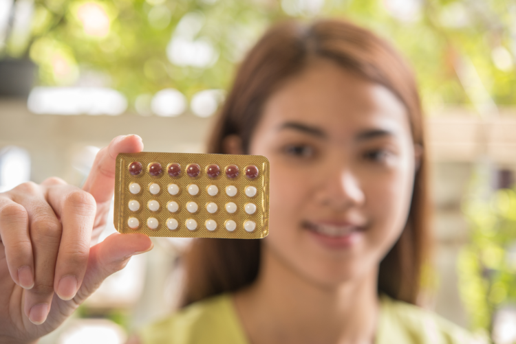 Woman hand holding a contraceptive panel prevent pregnancy